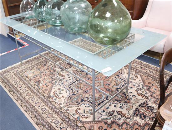 A contemporary wrought iron and glass top rectangular table L.214cm